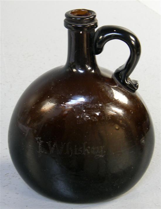 Appraisal: th century brown glass bottle one side engraved I Whiskey