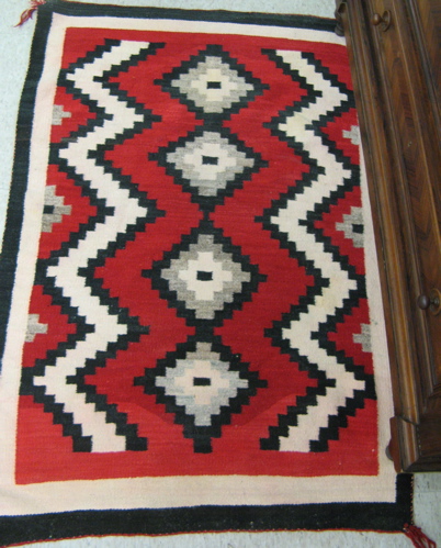 Appraisal: TWO NAVAJO AREA RUGS both red gray black and ivory