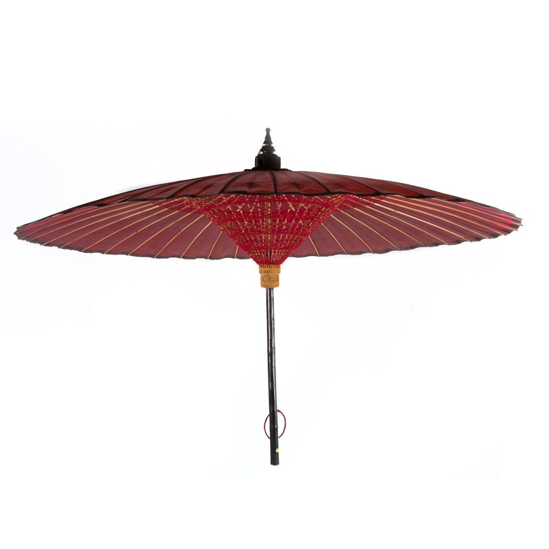 Appraisal: Large Burmese red-painted paper umbrella in H in Diam includes