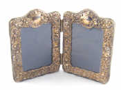 Appraisal: A folding pair of silver faced photo frames each x