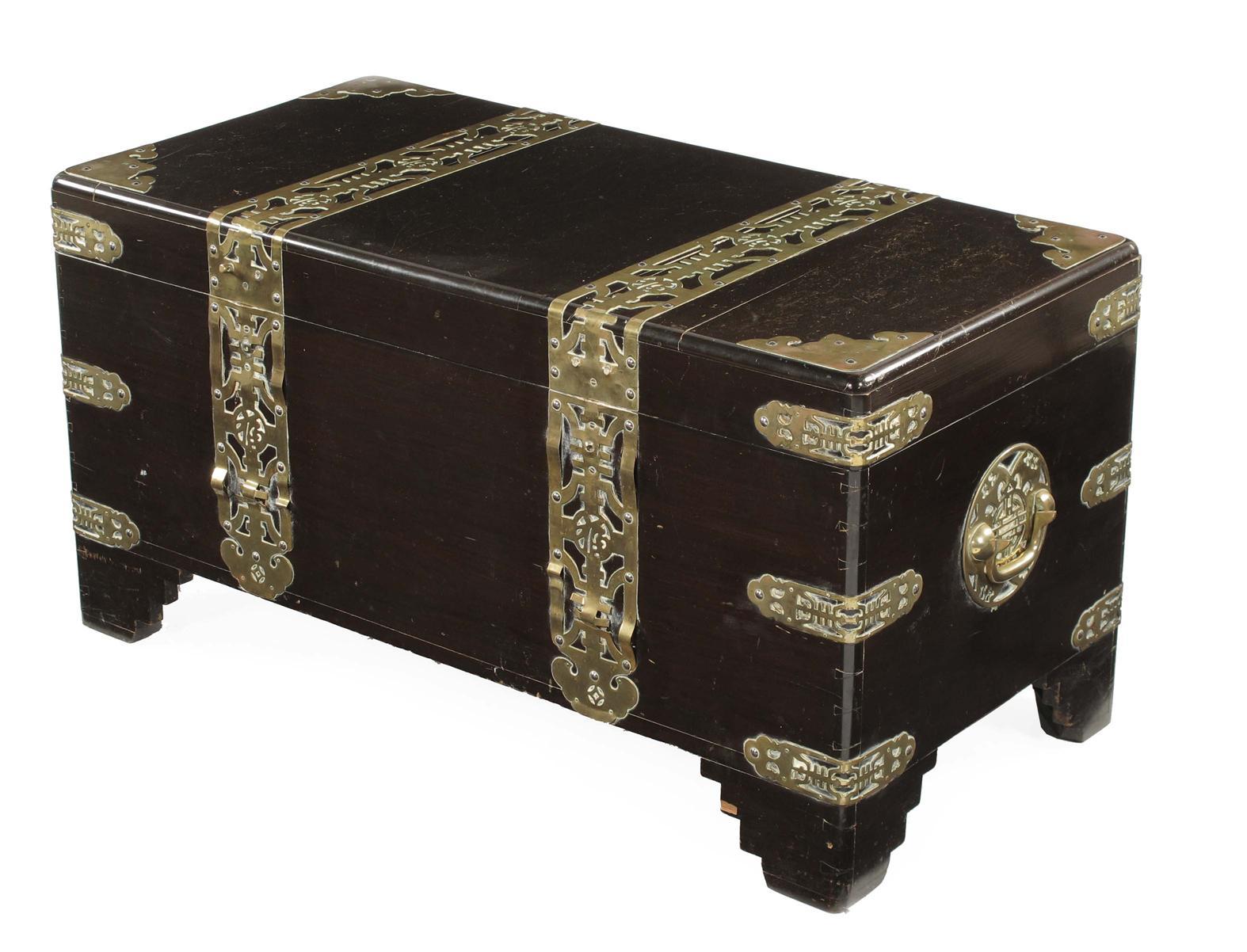 Appraisal: A Chinese stained wood and brass mounted trunk