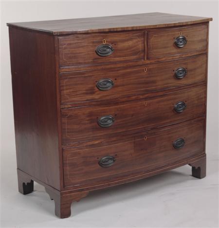 Appraisal: A George III mahogany bowfront chest with two short and