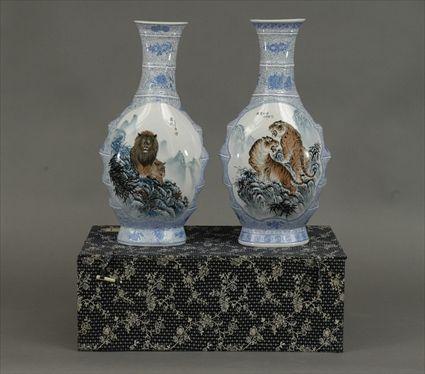 Appraisal: Pair of Chinese Eggshell Porcelain Vases Decorated with Lions and