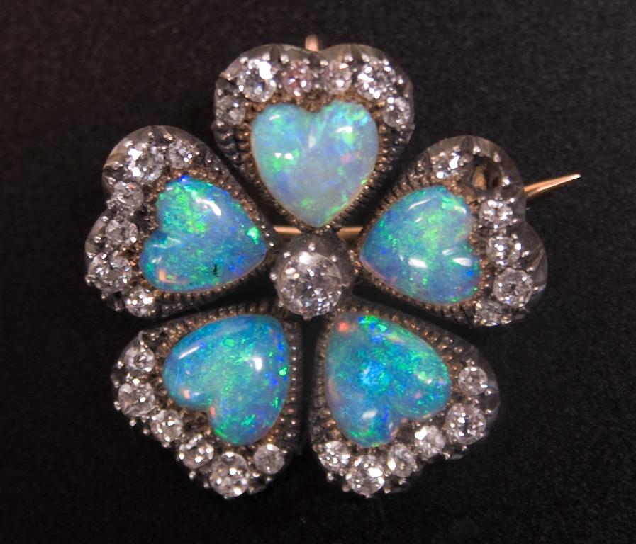 Appraisal: VICTORIAN OPAL AND DIAMOND BROOCH c of flowerhead form composed