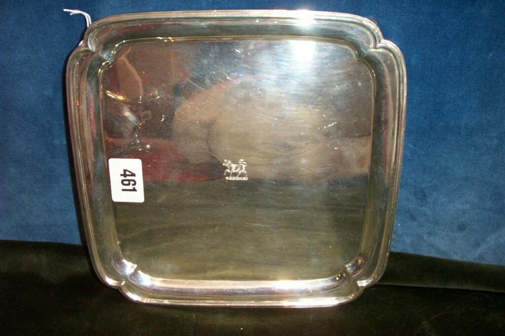 Appraisal: A silver salver of square cut form with raised border