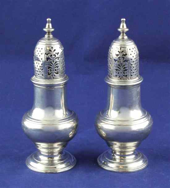 Appraisal: A pair of George II silver sugar casters of baluster