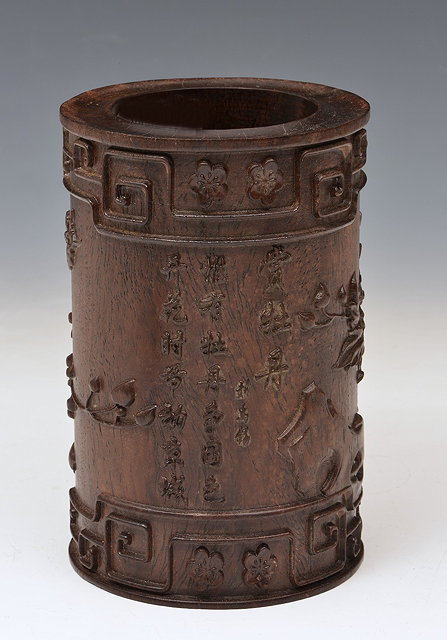 Appraisal: A CHINESE HARDWOOD BITUNG carved in relief with poem peony