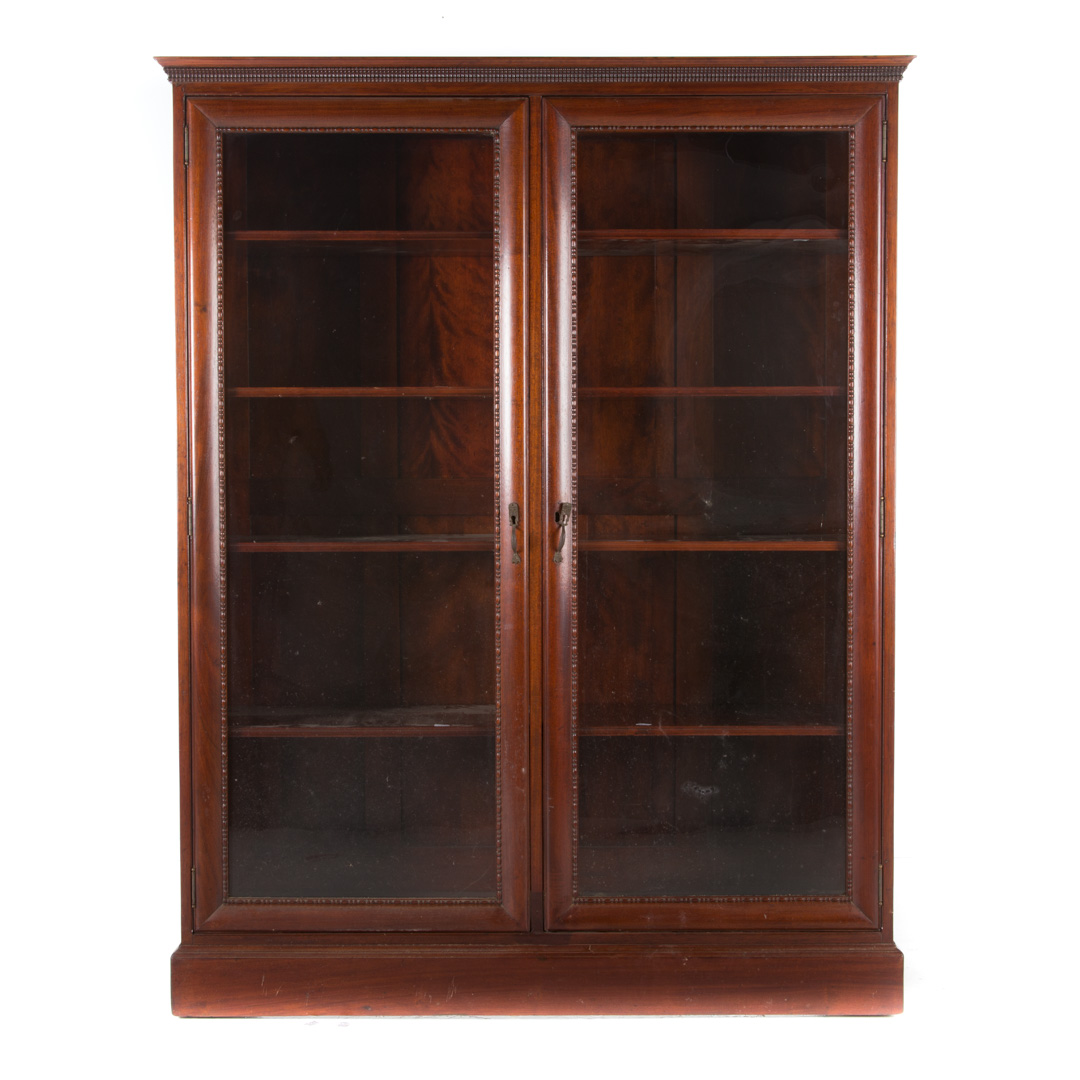 Appraisal: Elizabethan Revival walnut glass panel bookcase mid- th century flat