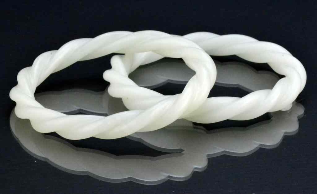 Appraisal: Pr Chinese Qing White Jade Bangle BraceletsFinely carved a twisted