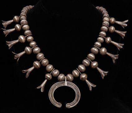 Appraisal: SOUTHWEST SQUASH BLOSSOM NAVAJO NECKLACE in See Pleasing The Spirits