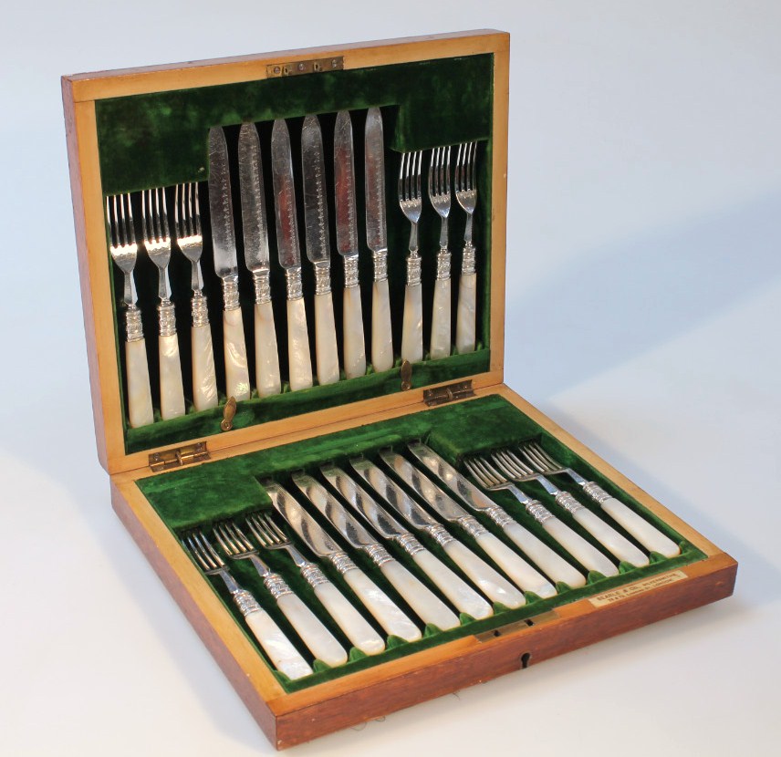 Appraisal: A set of silver plated dessert knives and forks with