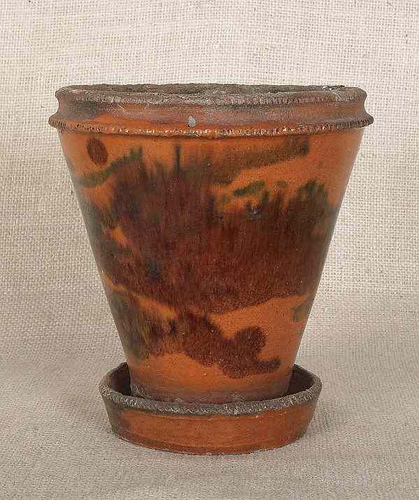 Appraisal: Pennsylvania redware flower pot th c with attached undertray and