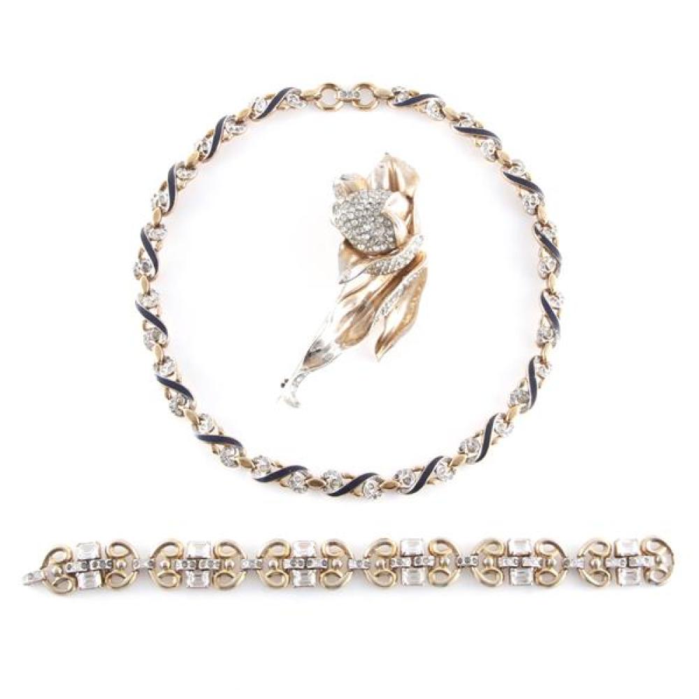 Appraisal: TRIFARI DIAMANTE AND GOLD TONE SCROLL LINK BRACELET WITH NAVY