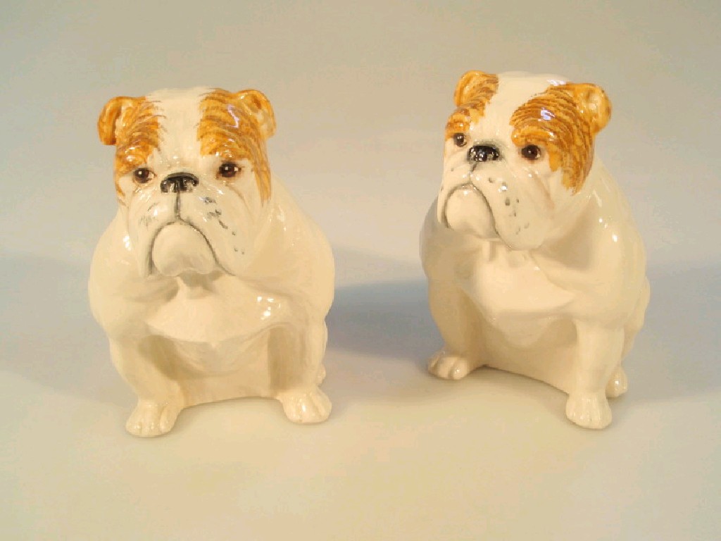 Appraisal: A pair of Royal Doulton models of seated bulldogs cm