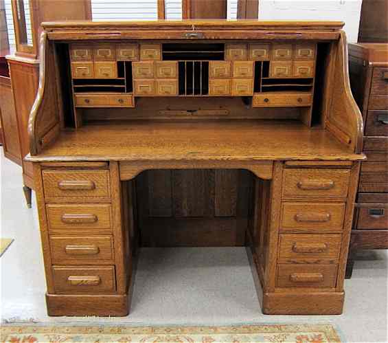 Appraisal: AN ANTIQUE OAK ROLL-TOP DESK American late th century having