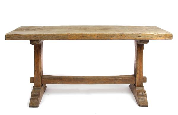 Appraisal: A Spanish Colonial style oak trestle table height in width