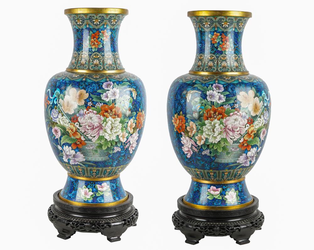 Appraisal: PAIR OF CLOISONNE TEMPLE VASESset atop carved stands Condition bases