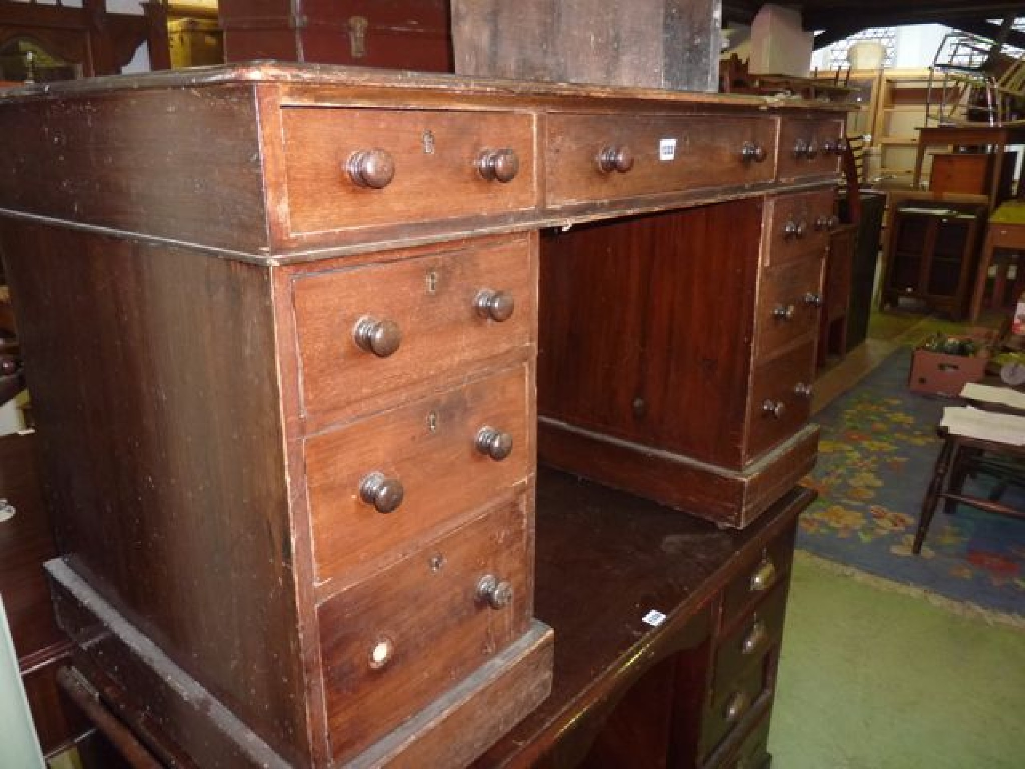 Appraisal: A Victorian mahogany and stained pine kneehole twin pedestal desk