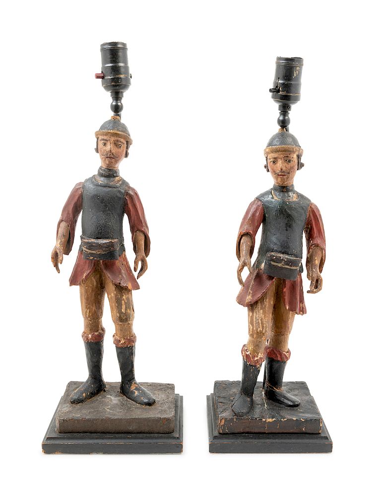 Appraisal: A Pair of Spanish Carved and Polychrome Decorated Figures A