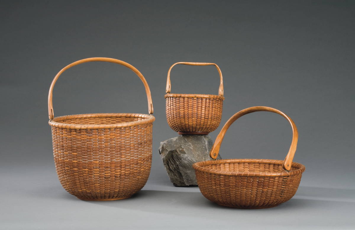 Appraisal: TALL CIRCULAR NANTUCKET BASKET WITH SWING HANDLE WILLIAM D APPLETON