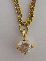 Appraisal: An carat gold diamond solitaire pendant the round brilliant cut