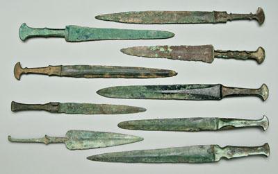 Appraisal: Eight ancient bronze daggers probably Luristan currently Iran all probably