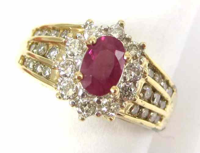 Appraisal: RUBY DIAMOND AND FOURTEEN KARAT GOLD RING set with round-cut