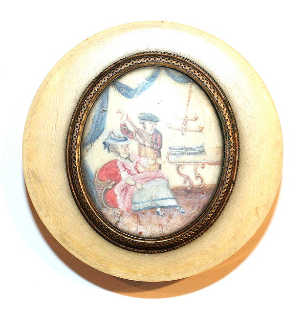 Appraisal: A GEORGIAN TURNED IVORY SNUFF BOX with oval inset painted