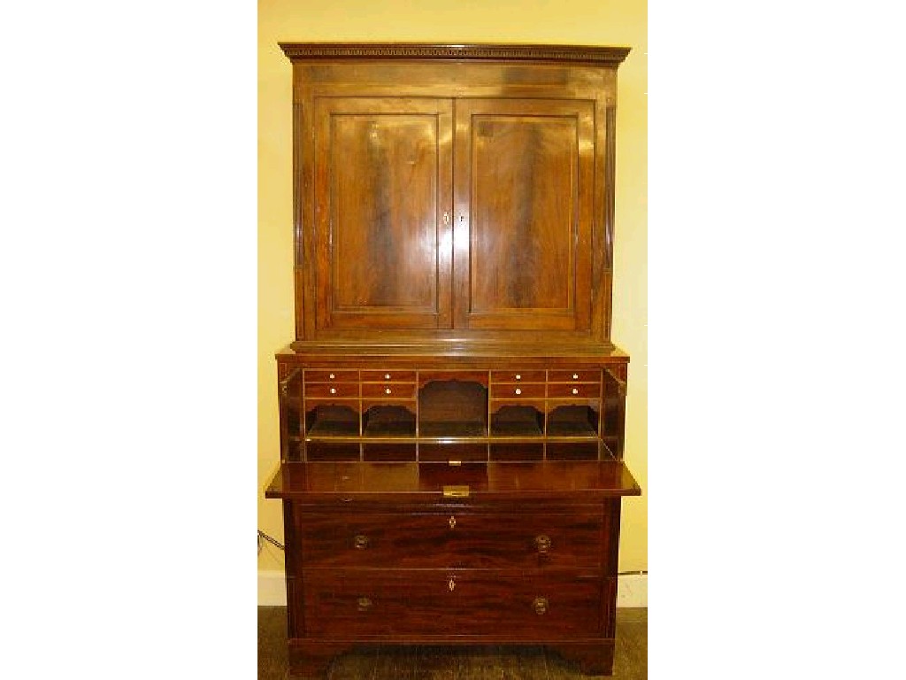 Appraisal: An early th century mahogany secretaire cupboard the secretaire drawer