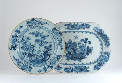 Appraisal: A Delftware meat dish painted in blue with flowers and