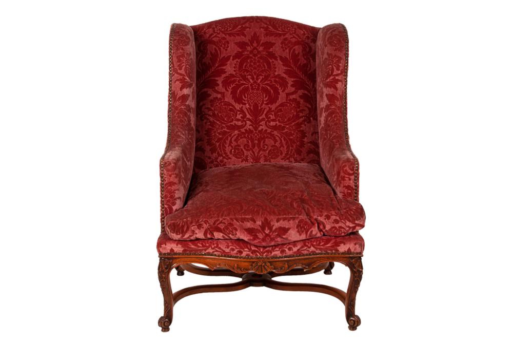 Appraisal: FRENCH REGENCE STYLE WALNUT BERGEREwith cut velvet damask upholstery Condition