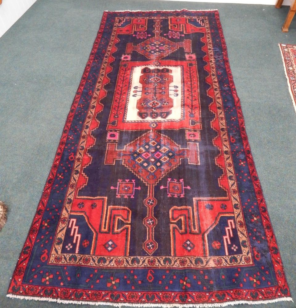 Appraisal: A Persian Hamadan style broad runner with a central red