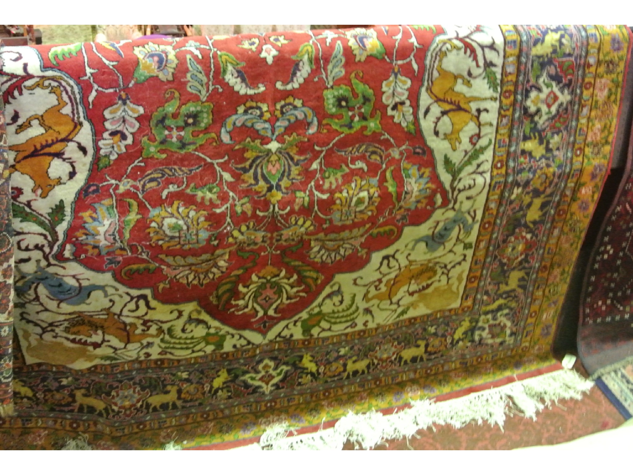 Appraisal: An extensive good quality wool work carpet the deep red