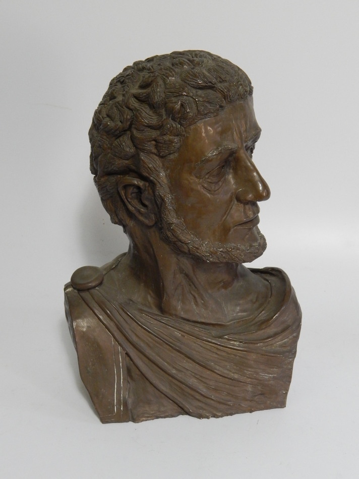 Appraisal: A bronze patinated white metal bust of a Roman senator