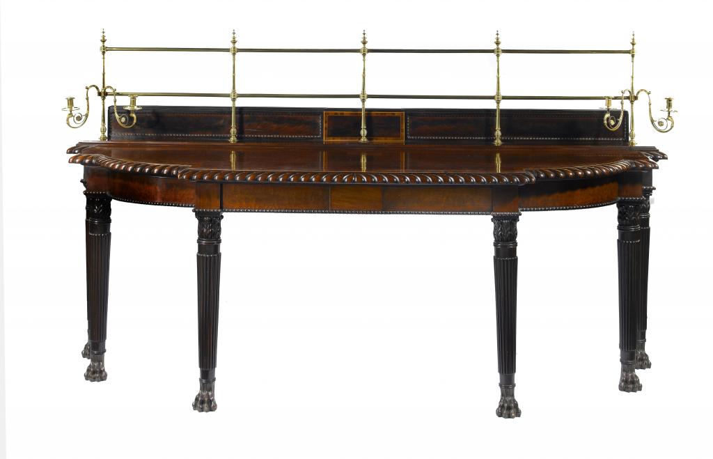 Appraisal: A REGENCY MAHOGANY SERVING TABLE of breakfront form with tablet-centred