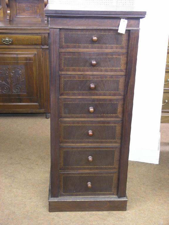 Appraisal: A reproduction inlaid mahogany Wellington chest hinged top above seven