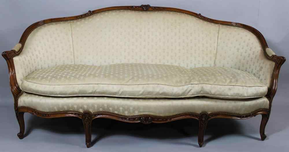 Appraisal: LOUIS XV STYLE MAHOGANY SETTEE the arched molded cresting rail