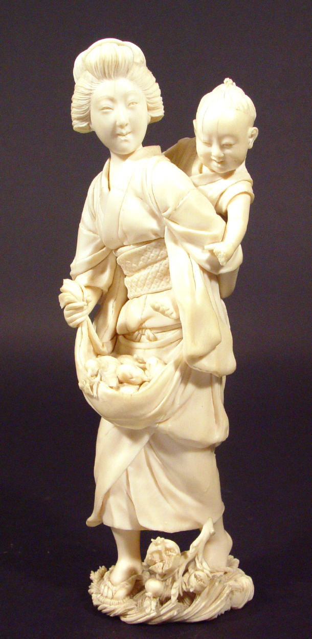 Appraisal: Oriental carved ivory geisha girl with child on her back