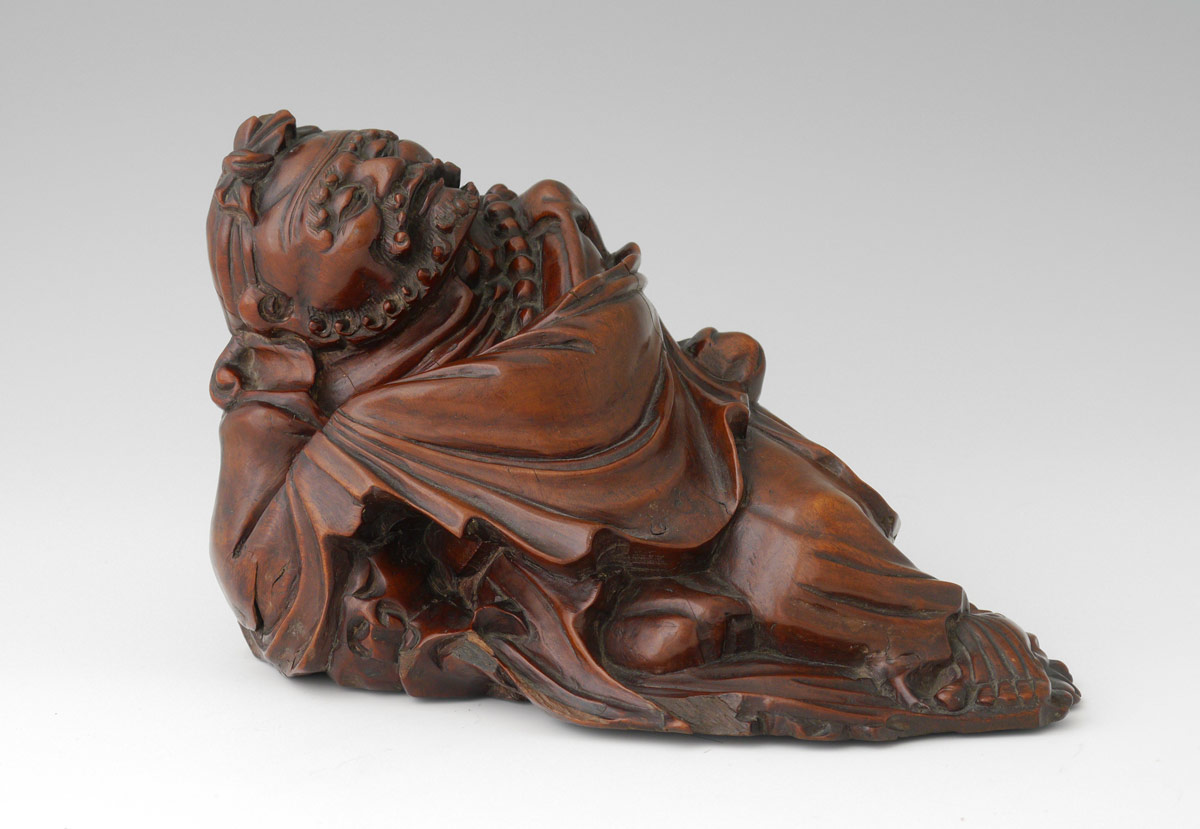 Appraisal: MEIJI PERIOD CARVED ROSEWOOD FIGURE Figure of a reclining man