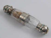 Appraisal: A double ended faceted glass perfume bottle with central locket