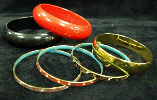 Appraisal: Three enamelled bangles together with a gold plated bangle by