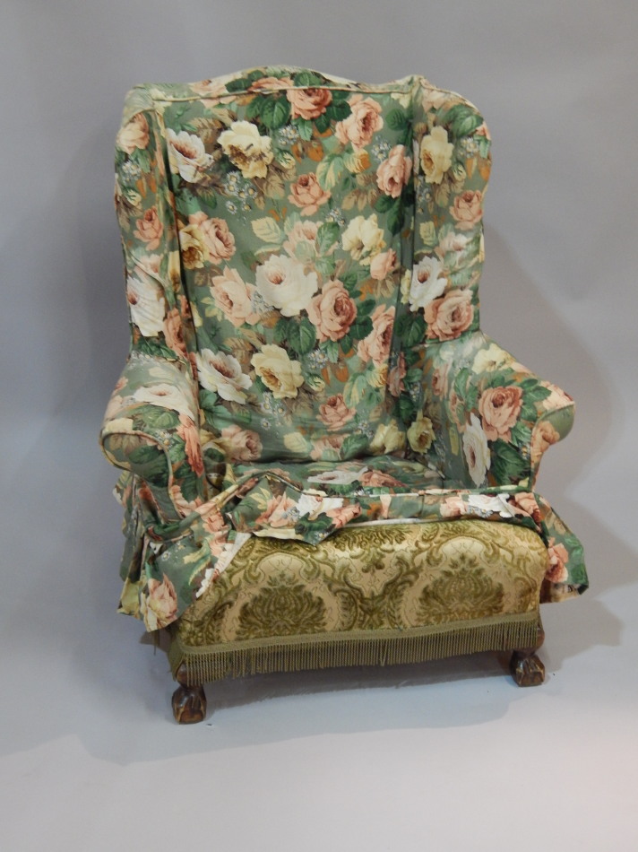 Appraisal: An early thC wingback armchair on short cabriole legs