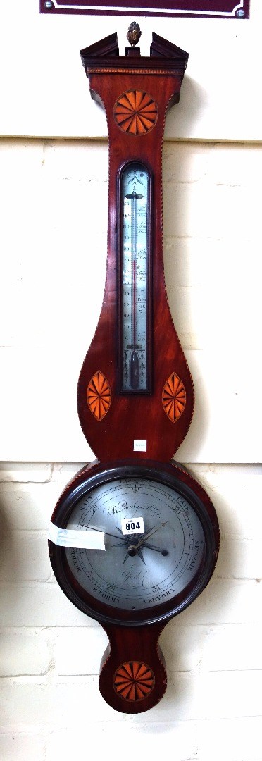 Appraisal: A mahogany and inlaid wheel barometer by 'B Peurely Fecit