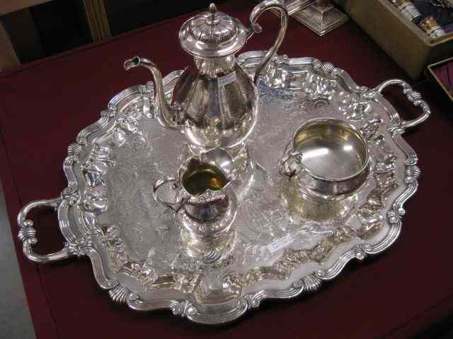 Appraisal: European Silverplate Tea Set on Finelarge handled tray teapot ''