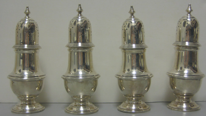 Appraisal: FOUR STERLING SILVER CASTERS Each of typical urn form with