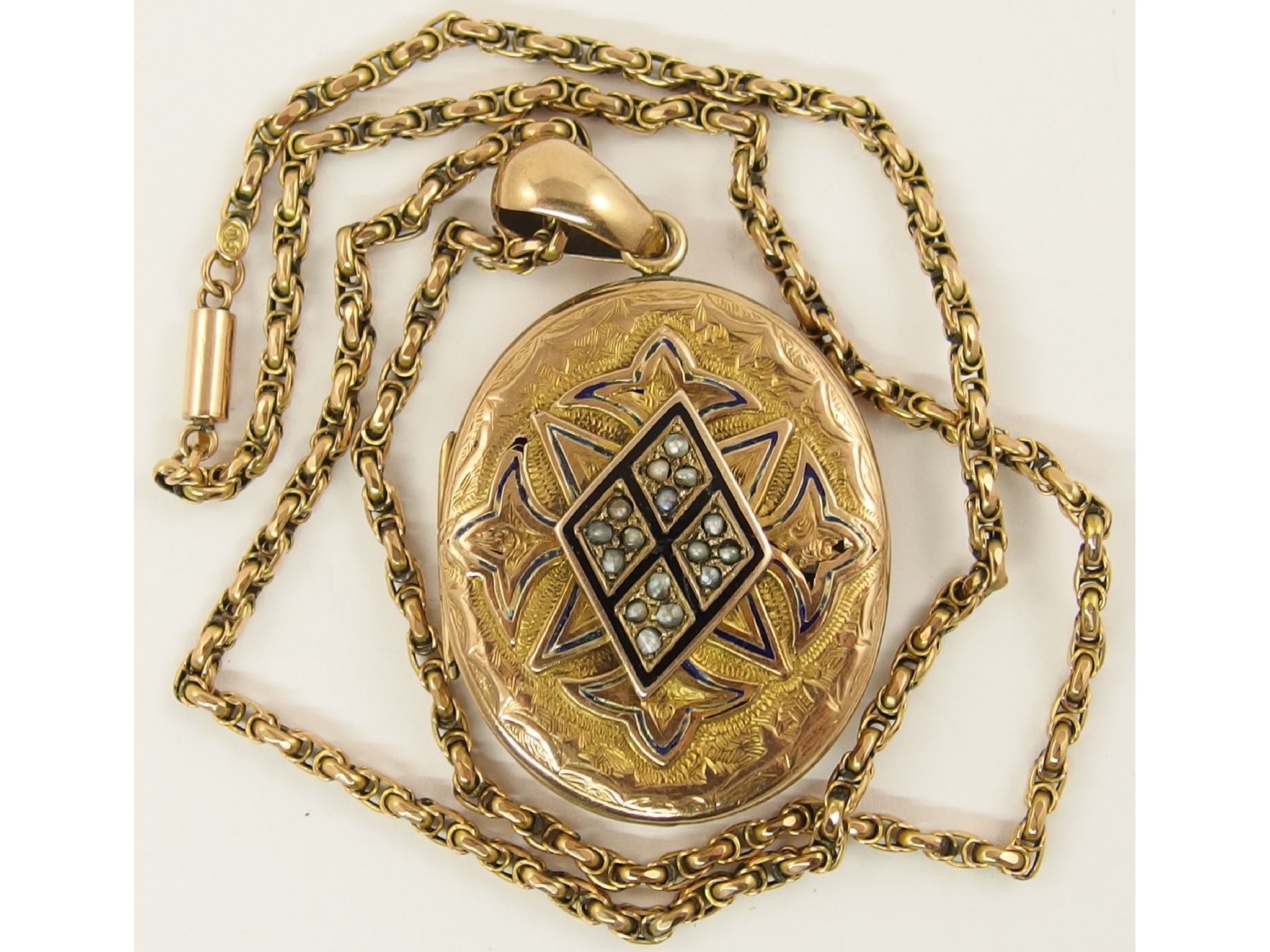 Appraisal: A Victorian locket set with seed pearls and black enamel