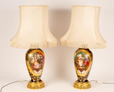 Appraisal: A pair of porcelain table lamps decorated panels of interior