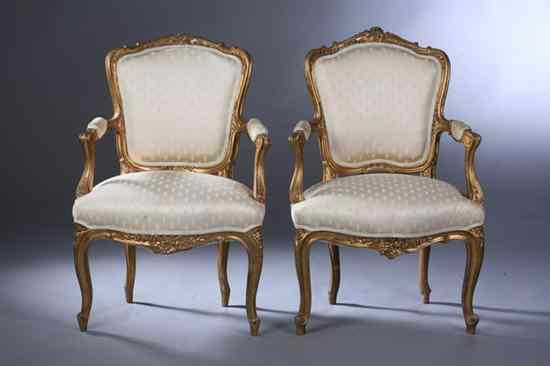 Appraisal: PAIR LOUIS XV STYLE GILTWOOD FAUTEUILS th century white damask