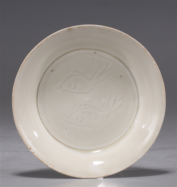 Appraisal: Fine Chinese Northern Song Dynasty dingyao glazed dish with incised