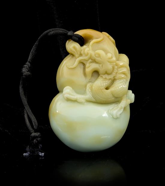 Appraisal: Sale Lot A Carved Jade Toggle the pale celadon having